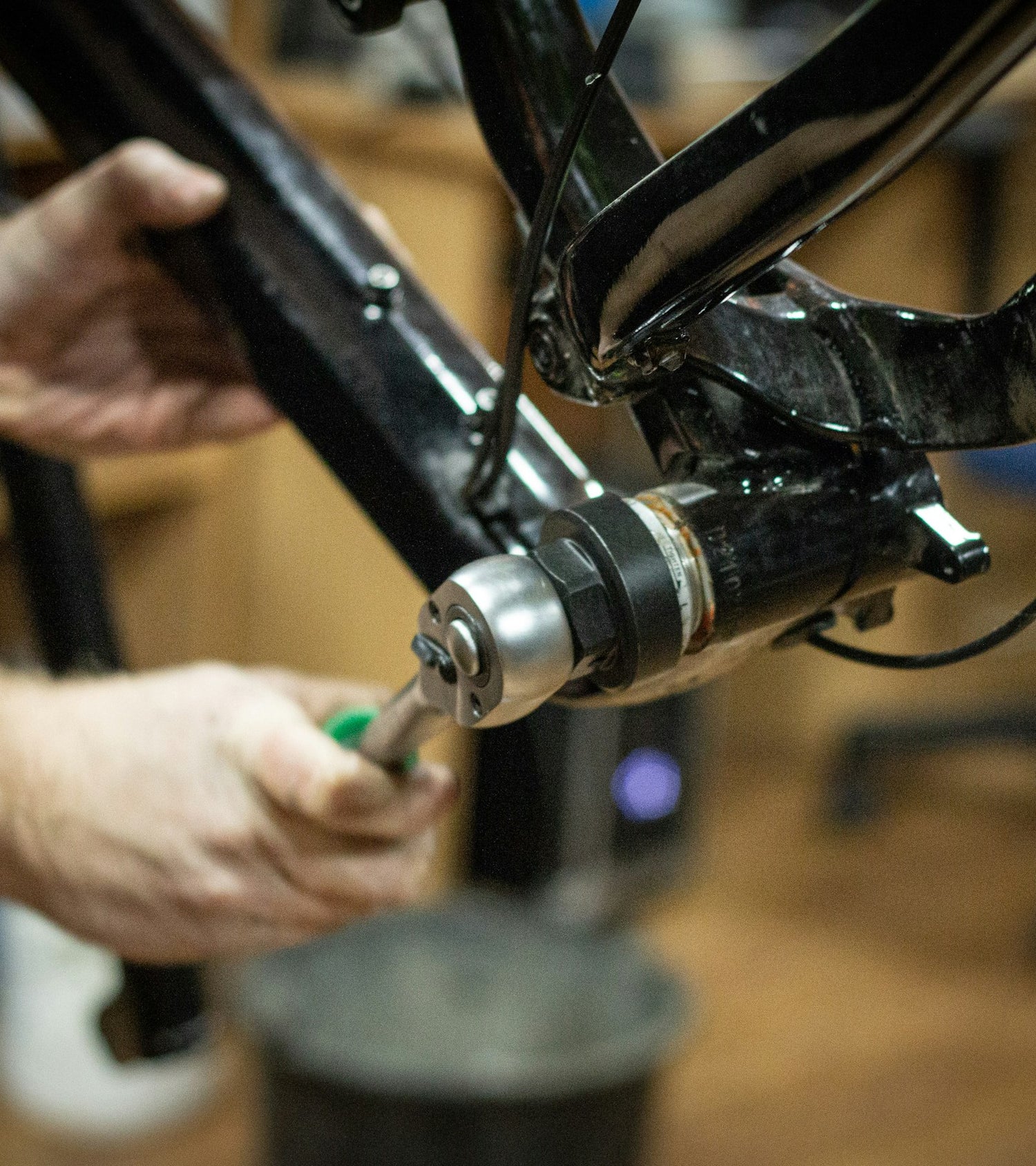 A mechanic rebuilding a bike at the workbench